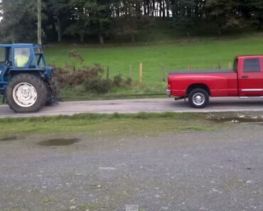 Dodge Ram Cummins vs Ford Tractor in a Tug of War!
