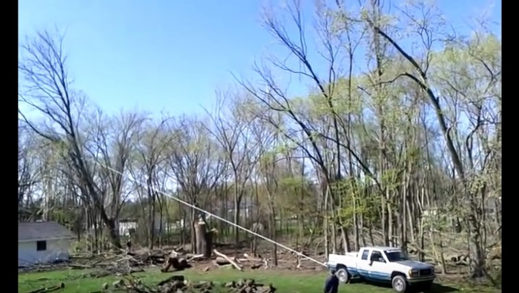 Truck Pulling Tree Falls the Wrong Way!