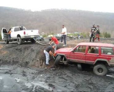 How “NOT” to pull a truck out of the mud!!