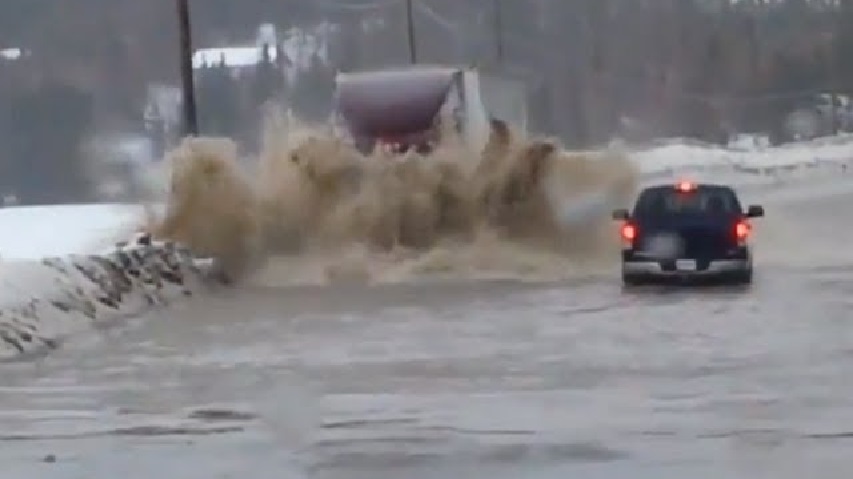 Semi-Truck-vs-Flood-–-No-Slowing-This-Guy-Down