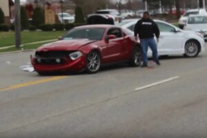 Watch Another Douchebag Mustang Driver Crash Into A Car When Leaving A Car Meet