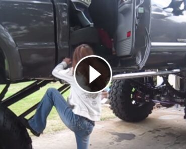 Cute Girl Giving a Struggle to Climb into Giant Ford F-250