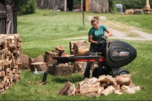 Girls and Log Splitter, Chainsaw, Circular Saw. New Technologies Chopping Wood